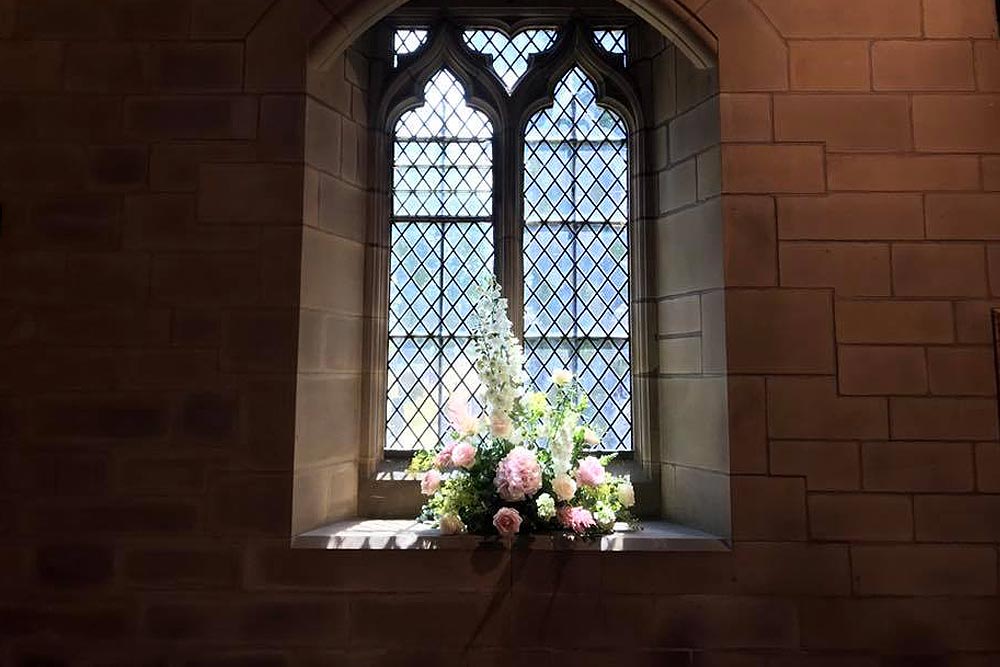 Funeral flowers in window by All Occasions of Howden