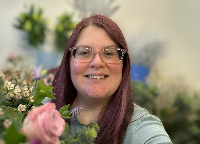 Fiona Waddingham, florist and owner of All Occasions in Howden, East Riding of Yorkshire, holding a floral arrangement.